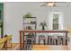 Bright living space with dining table, shelving, and lots of natural light at 2643 N Marion St, Denver, CO 80205