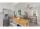Bright, open-concept living and dining area featuring hardwood floors and modern finishes at 2643 N Marion St, Denver, CO 80205