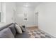 The living area features a couch, a patterned rug, and bright white paint at 2643 N Marion St, Denver, CO 80205