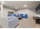 Basement living space with a comfortable seating arrangement and neutral carpet at 4529 Vrain St, Denver, CO 80212