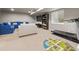 Spacious finished basement featuring a blue sofa and exercise equipment at 4529 Vrain St, Denver, CO 80212