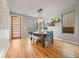 Bright dining room featuring hardwood floors, stylish lighting, and contemporary decor at 4529 Vrain St, Denver, CO 80212
