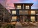 Contemporary two-story home with stone and wood accents, a well-maintained front yard and welcoming entryways at 4529 Vrain St, Denver, CO 80212