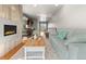 Inviting living room with fireplace, hardwood floors, stylish decor, and great natural light at 4529 Vrain St, Denver, CO 80212