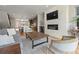Open-concept living area with fireplace and hardwood floors, seamlessly connected to the modern kitchen at 4529 Vrain St, Denver, CO 80212
