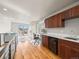 Cozy living space with a kitchenette, wooden floors, modern lighting, and views of the outdoors at 4529 Vrain St, Denver, CO 80212