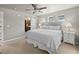 Serene main bedroom featuring a plush bed, soft lighting, and a doorway to the en-suite bathroom at 4529 Vrain St, Denver, CO 80212
