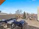 Relaxing rooftop deck with lounge chairs, wood-style flooring, and scenic neighborhood views at 4529 Vrain St, Denver, CO 80212