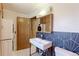 Well-lit bathroom features a sleek modern vanity, patterned tile backsplash, and stackable washer/dryer units at 4580 Balsam St, Wheat Ridge, CO 80033