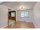 Bright dining room with hardwood floors, classic chandelier, and ample natural light at 4580 Balsam St, Wheat Ridge, CO 80033