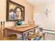 Eclectic dining room with custom artwork, tile flooring and unique decorations at 7000 Highland Dr, Lakewood, CO 80214