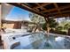 Enjoy the backyard hot tub with views of the deck and beautifully designed brick home at 7000 Highland Dr, Lakewood, CO 80214