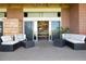 Expansive brick patio with stylish seating and sliding glass doors leading indoors, perfect for entertaining at 7000 Highland Dr, Lakewood, CO 80214