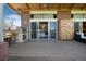 Spacious outdoor patio featuring a built-in grill, bar seating, and access to the home's interior at 7000 Highland Dr, Lakewood, CO 80214