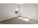 Neutral bedroom featuring a large window and carpeted flooring, offering a serene ambiance at 7208 Dolores Ave, Frederick, CO 80530