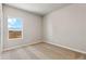 Cozy bedroom features neutral carpeting and a window offering pleasant natural light at 7208 Dolores Ave, Frederick, CO 80530