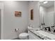 Modern bathroom featuring a granite countertop vanity, toilet, and framed mirror at 837 E 98Th Ave # 403, Thornton, CO 80229