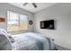 Bright bedroom with a ceiling fan, nautical decor, and a large window with natural light at 837 E 98Th Ave # 403, Thornton, CO 80229