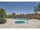 Outdoor community pool area with a hot tub, lounge chairs and wood pergolas at 837 E 98Th Ave # 403, Thornton, CO 80229