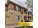 Attractive condo complex featuring earth-tone stucco, dark shutters and cozy second story terraces at 837 E 98Th Ave # 403, Thornton, CO 80229