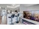 Open-concept kitchen featuring stainless steel appliances, granite countertops and bar stool seating at 837 E 98Th Ave # 403, Thornton, CO 80229