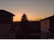 Scenic sunset view featuring mountains and tree silhouetted against the colorful sky at 837 E 98Th Ave # 403, Thornton, CO 80229