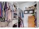 Organized walk-in closet with shelving, hanging rods, and a built-in dresser at 837 E 98Th Ave # 403, Thornton, CO 80229