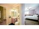 View of the home's bathroom with a decorative sink, mirror, and a nautical-themed hand towel at 7656 Depew St # 1802, Arvada, CO 80003