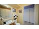 Bright bathroom with vanity sink, nautical decorations, and tiled floors at 7656 Depew St # 1802, Arvada, CO 80003