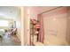 Well-maintained bathroom with a shower, storage shelves, and coordinated pink and green accents at 7656 Depew St # 1802, Arvada, CO 80003