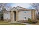 Charming condo exterior with stone accents and inviting entryway staircase at 7656 Depew St # 1802, Arvada, CO 80003