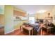 Inviting living room with hardwood floors, fireplace, and open layout to the kitchen at 7656 Depew St # 1802, Arvada, CO 80003
