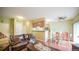 Comfortable living room and dining area with a cozy sofa, dining table, and modern ceiling fan at 7656 Depew St # 1802, Arvada, CO 80003
