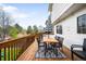 Spacious backyard deck with outdoor dining and lounging area and an umbrella at 9574 Las Colinas Dr, Lone Tree, CO 80124