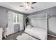Charming bedroom features a canopy bed, soft white drapes, and a cozy, inviting atmosphere at 9574 Las Colinas Dr, Lone Tree, CO 80124