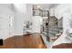 Welcoming entryway with staircase, wood floors, and a view of the upper level at 9574 Las Colinas Dr, Lone Tree, CO 80124