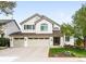 Charming two-story home with three-car garage and well-manicured lawn at 9574 Las Colinas Dr, Lone Tree, CO 80124