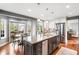 Spacious kitchen with granite island, stainless steel appliances and view to the breakfast nook at 9574 Las Colinas Dr, Lone Tree, CO 80124