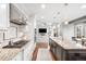 Open kitchen with stainless steel appliances and granite countertops at 9574 Las Colinas Dr, Lone Tree, CO 80124