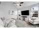 Bright living room with vaulted ceilings, plush carpeting, and modern decor at 9574 Las Colinas Dr, Lone Tree, CO 80124