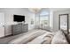 Light-filled main bedroom features a chandelier, a bay window and a sitting area at 9574 Las Colinas Dr, Lone Tree, CO 80124
