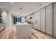 Spacious kitchen featuring a large center island, stainless appliances, and sleek cabinets at 3232 W 16Th Ave, Denver, CO 80204