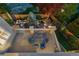Aerial view of a home with backyard featuring outdoor dining, seating, and landscaped garden with a pond at 10837 Fox Sedge Way, Highlands Ranch, CO 80126
