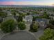 Picturesque aerial view of a home nestled in a neighborhood with mountain views and mature trees at 10837 Fox Sedge Way, Highlands Ranch, CO 80126