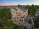 Aerial view of a spacious home with a lush backyard, stone patio, outdoor fireplace and mature trees at 10837 Fox Sedge Way, Highlands Ranch, CO 80126