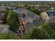 Aerial view of the house in a neighborhood, surrounded by lush greenery and mature trees at 10837 Fox Sedge Way, Highlands Ranch, CO 80126