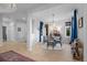 Formal dining room featuring hardwood floors, chandelier, and tasteful decor for memorable gatherings at 10837 Fox Sedge Way, Highlands Ranch, CO 80126