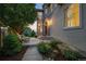 Charming home exterior featuring a stone-accented entrance, beautiful landscaping, and inviting pathway at 10837 Fox Sedge Way, Highlands Ranch, CO 80126