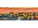 A picturesque landscape showcases the neighborhood, mountain views and colorful trees at 10837 Fox Sedge Way, Highlands Ranch, CO 80126