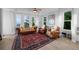 Cozy living room with large windows providing ample natural light and scenic views at 10837 Fox Sedge Way, Highlands Ranch, CO 80126
